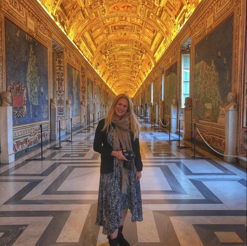 Visitors exploring the Vatican Gallery of Maps in the Vatican Museums, Rome, Italy, surrounded by detailed 16th-century frescoed maps
