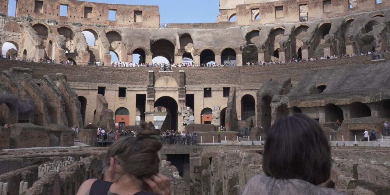 Guests standing on the arena floor during a colosseum with arena access and ancient rome small group tour